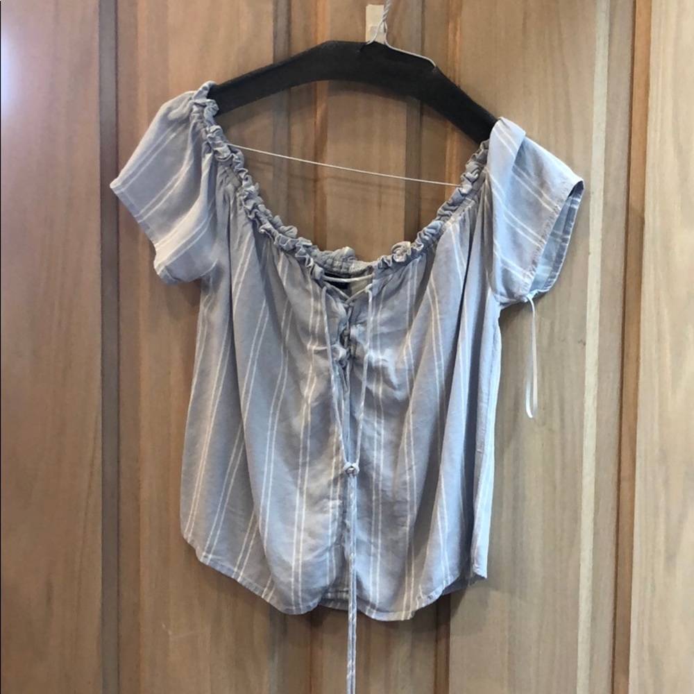 A blue and white striped flowy shirt